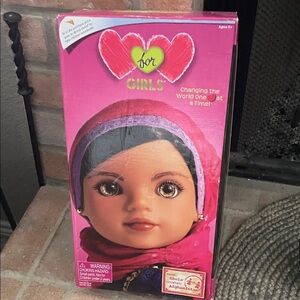 Cultural Adventure Doll with Pink and Blue Dress